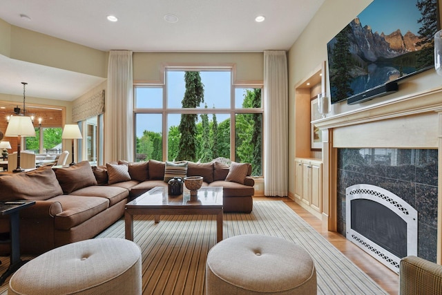7250 Jubert Ln, Corcoran, MN 55340 - living room featuring a fireplace, plenty of natural light, recessed lighting, and light wood-style floors