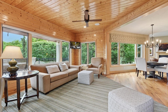 7250 Jubert Ln, Corcoran, MN 55340 - living room with a chandelier, wood finished floors, and ceiling fan