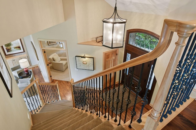 7250 Jubert Ln, Corcoran, MN 55340 - staircase featuring wood finished floors and baseboards