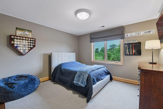 7250 Jubert Ln, Corcoran, MN 55340 - carpeted bedroom featuring baseboards and a textured ceiling