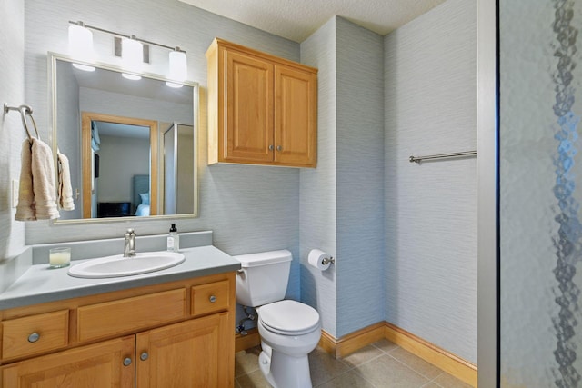7250 Jubert Ln, Corcoran, MN 55340 - bathroom featuring vanity, toilet, tile patterned floors, and a textured ceiling