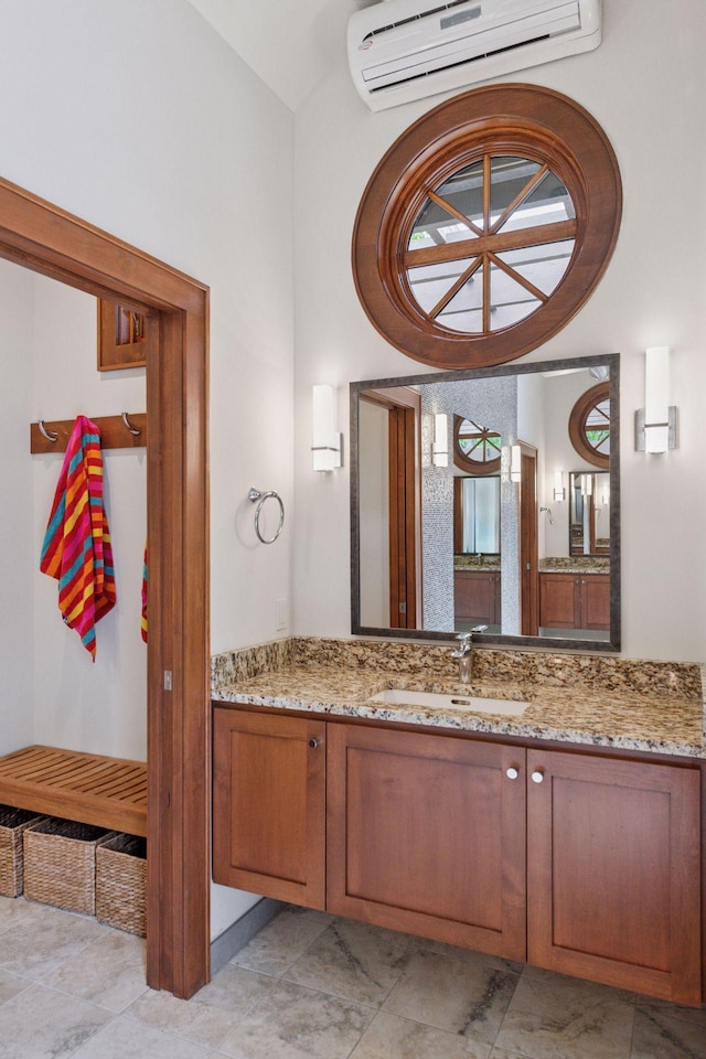7250 Jubert Ln, Corcoran, MN 55340 - bathroom featuring a wall mounted air conditioner and vanity