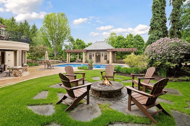 7250 Jubert Ln, Corcoran, MN 55340 - view of patio featuring a fire pit, an outdoor pool, and a balcony