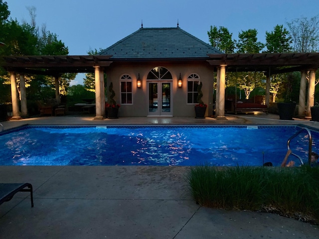 7250 Jubert Ln, Corcoran, MN 55340 - outdoor pool featuring a pergola, french doors, an exterior structure, an outdoor structure, and a patio area