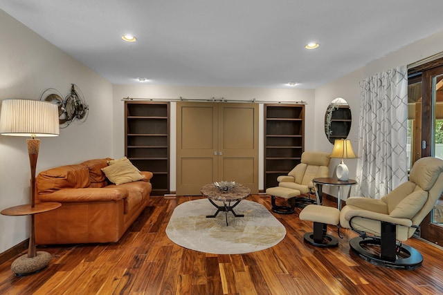 living room featuring wood finished floors, baseboards, and recessed lighting