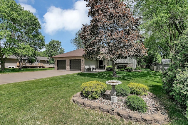 1410 4th Ave N, Sartell, MN 56377 - view of front of house featuring a garage, concrete driveway, a front yard, and brick siding