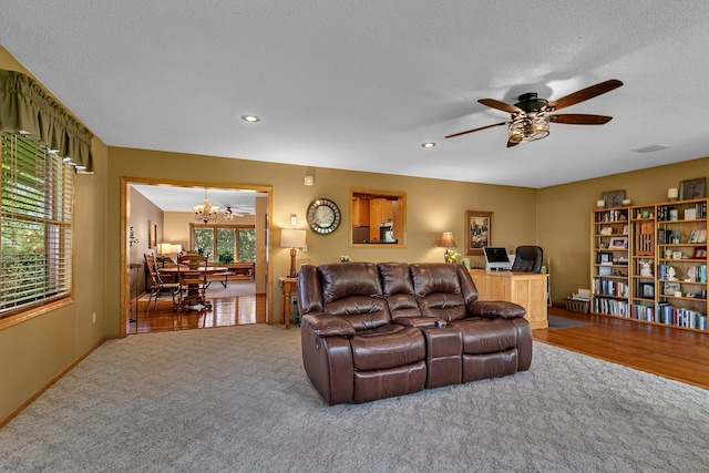 1410 4th Ave N, Sartell, MN 56377 - carpeted living room featuring a chandelier, baseboards, a ceiling fan, recessed lighting, and an office area