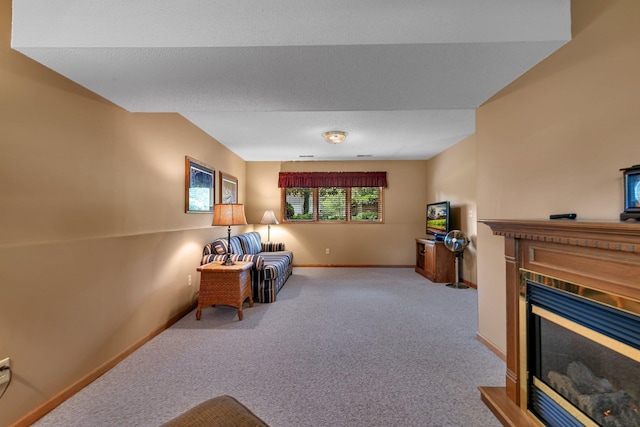1410 4th Ave N, Sartell, MN 56377 - living area with a glass covered fireplace, baseboards, and carpet flooring