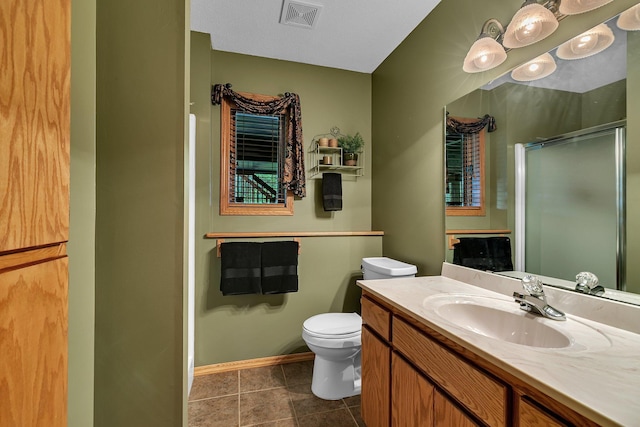 1410 4th Ave N, Sartell, MN 56377 - bathroom with a stall shower, toilet, vanity, baseboards, and tile patterned floors