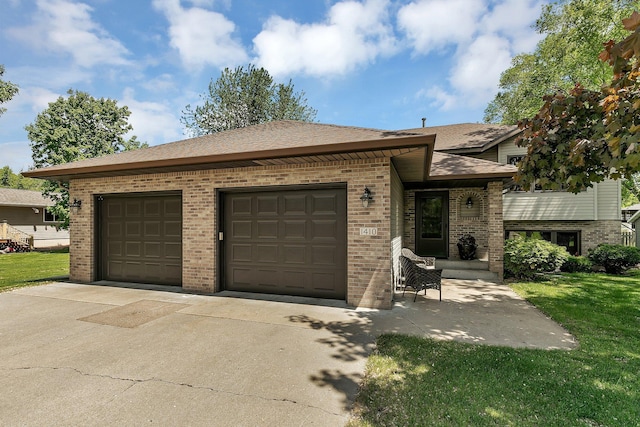 1410 4th Ave N, Sartell, MN 56377 - split level home featuring brick siding, driveway, an attached garage, and a front lawn