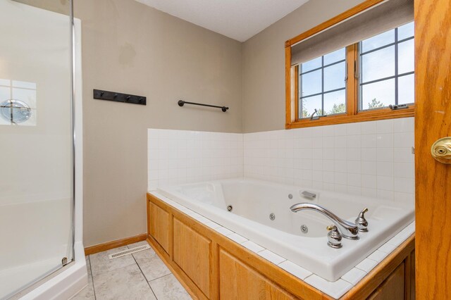235 Morning View Rd, Sauk Centre, MN 56378 - full bathroom with visible vents, a shower with shower door, baseboards, tile patterned floors, and a whirlpool tub