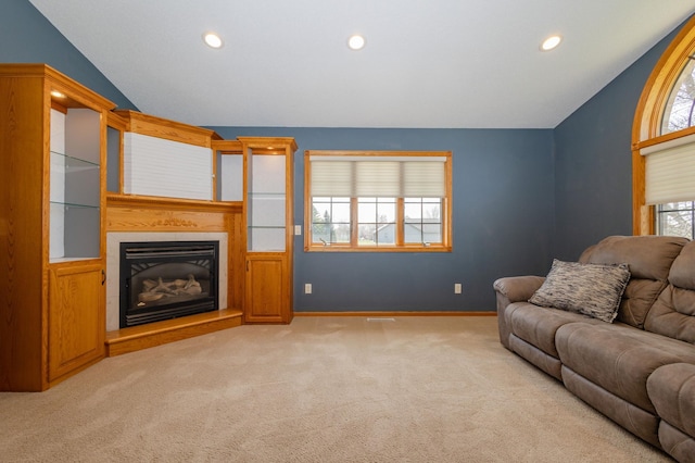 235 Morning View Rd, Sauk Centre, MN 56378 - living room featuring a glass covered fireplace, baseboards, recessed lighting, and light colored carpet