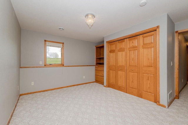 235 Morning View Rd, Sauk Centre, MN 56378 - unfurnished bedroom featuring baseboards, carpet, visible vents, and a closet