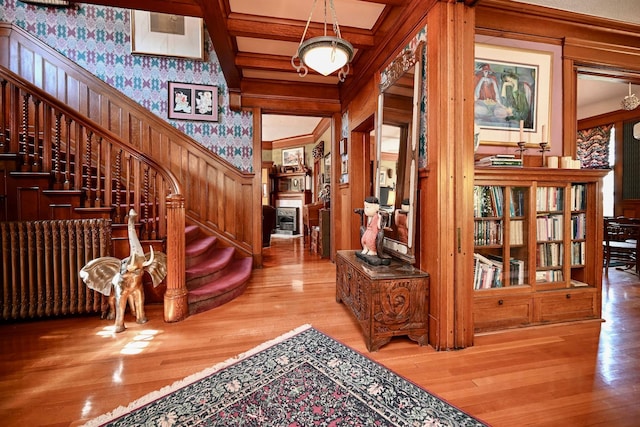 265 Broadway St, Winona, MN 55987 - entryway with wallpapered walls, stairs, and wood finished floors