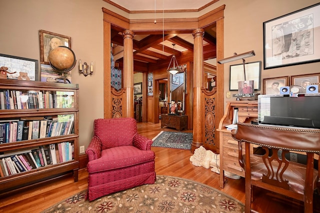 265 Broadway St, Winona, MN 55987 - living area featuring ornate columns, wood finished floors, and ornamental molding