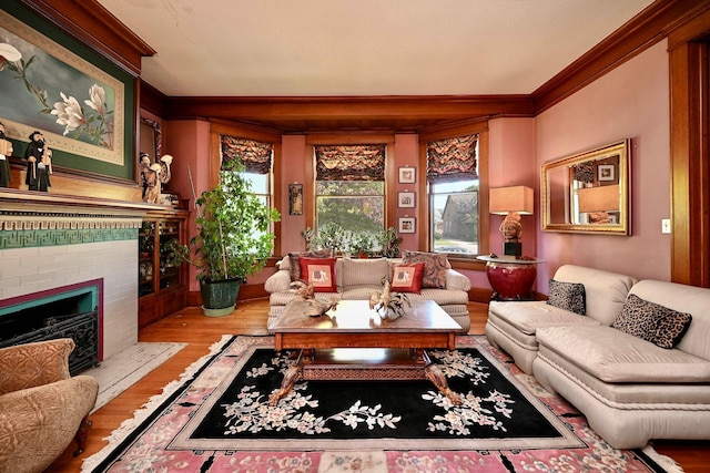 265 Broadway St, Winona, MN 55987 - living room featuring ornamental molding, wood finished floors, and a brick fireplace