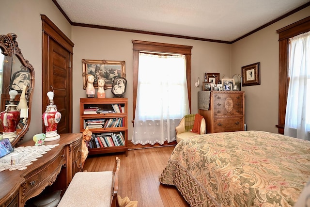 265 Broadway St, Winona, MN 55987 - bedroom with wood finished floors and crown molding