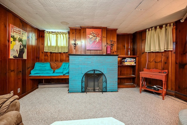 265 Broadway St, Winona, MN 55987 - living area with wood walls, carpet floors, and a fireplace