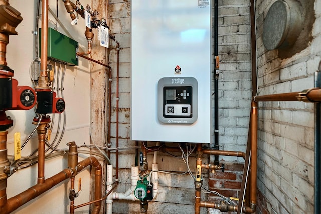 265 Broadway St, Winona, MN 55987 - utility room featuring water heater