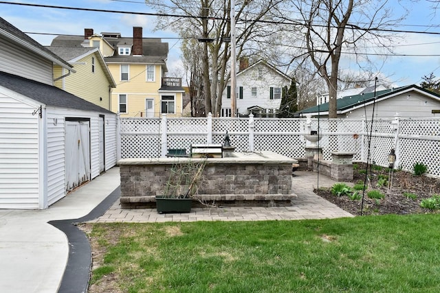265 Broadway St, Winona, MN 55987 - view of patio / terrace with a residential view and a storage shed