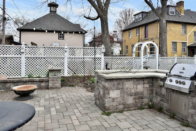 265 Broadway St, Winona, MN 55987 - fenced backyard with area for grilling and a patio area