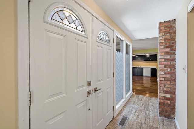 foyer entrance with light wood-style flooring