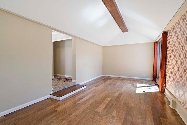 bonus room with wood finished floors and baseboards