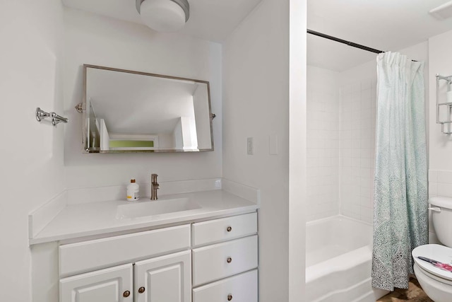 bathroom with toilet, shower / bath combination with curtain, and vanity