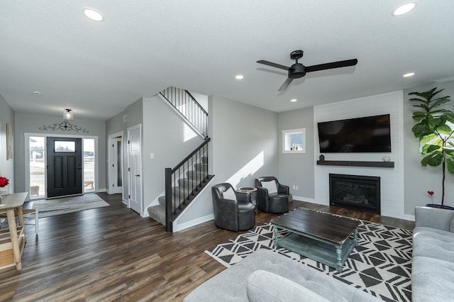 living room with recessed lighting, stairway, a ceiling fan, baseboards, and wood finished floors