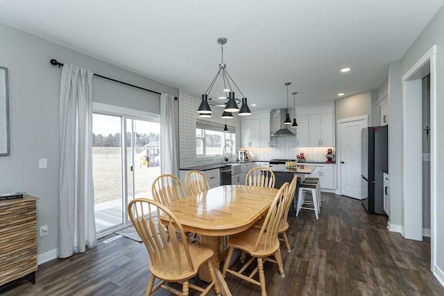 dining space with recessed lighting, baseboards, a chandelier, and dark wood-type flooring