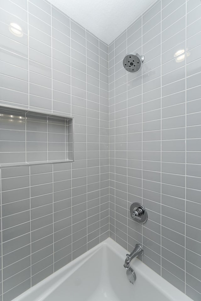full bathroom with washtub / shower combination
