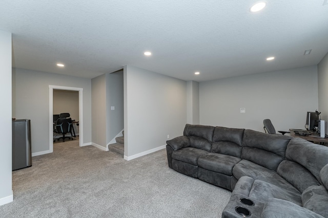 carpeted living area with recessed lighting, stairway, and baseboards