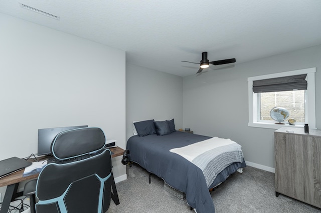 bedroom featuring visible vents, ceiling fan, light carpet, and baseboards
