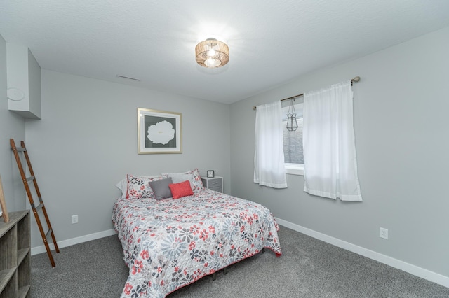 bedroom with carpet floors and baseboards
