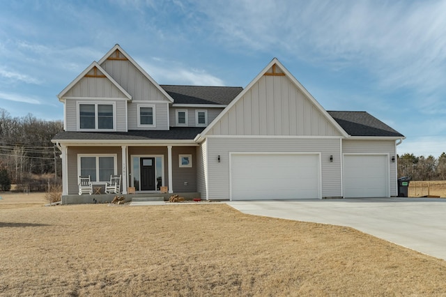 craftsman-style home with a garage, a shingled roof, covered porch, board and batten siding, and concrete driveway