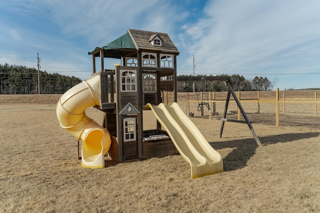 view of playground featuring fence