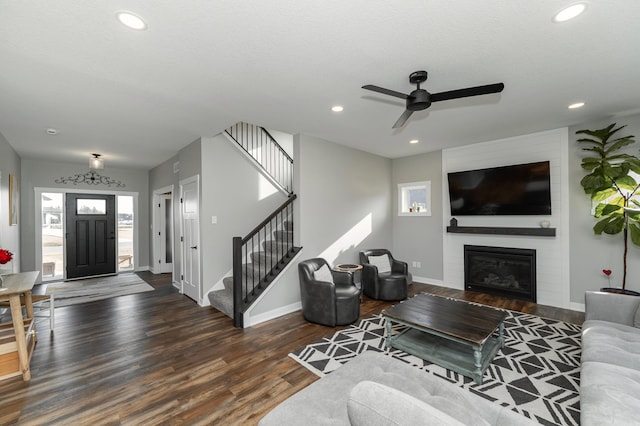 1261 Skyview Cir NW, Rochester, MN 55901 - living room featuring wood finished floors, baseboards, stairs, ceiling fan, and recessed lighting