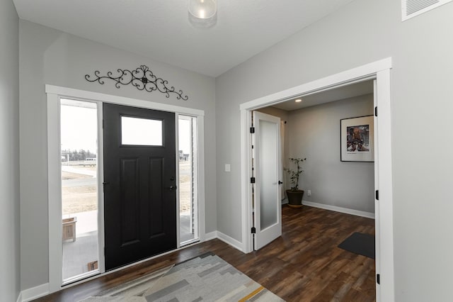 1261 Skyview Cir NW, Rochester, MN 55901 - foyer entrance with baseboards and dark wood-style flooring