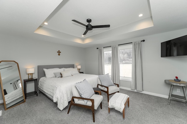 1261 Skyview Cir NW, Rochester, MN 55901 - carpeted bedroom with a tray ceiling, baseboards, recessed lighting, and ceiling fan