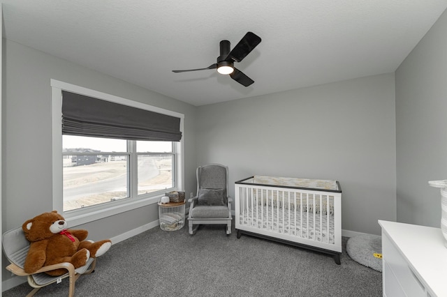 1261 Skyview Cir NW, Rochester, MN 55901 - carpeted bedroom featuring baseboards, a nursery area, and a ceiling fan