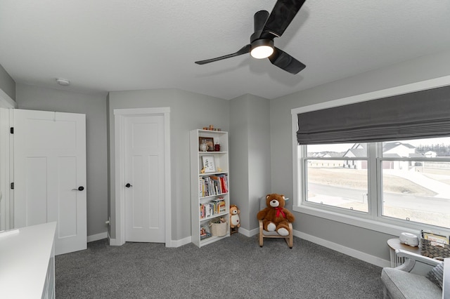 1261 Skyview Cir NW, Rochester, MN 55901 - rec room with ceiling fan, carpet floors, and baseboards