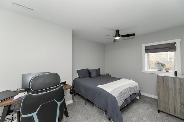 1261 Skyview Cir NW, Rochester, MN 55901 - bedroom with baseboards, a ceiling fan, an office area, and light colored carpet