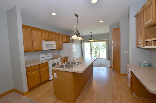 11096 16th St NE, Saint Michael, MN 55376 - kitchen featuring white appliances, a sink, a center island with sink, light wood-style flooring, and recessed lighting