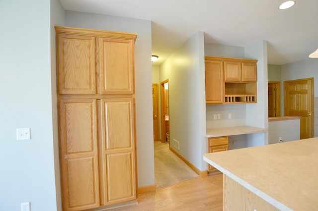 11096 16th St NE, Saint Michael, MN 55376 - kitchen featuring light brown cabinets, light wood finished floors, light countertops, baseboards, and open shelves