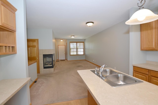 11096 16th St NE, Saint Michael, MN 55376 - kitchen with a sink, open floor plan, a fireplace, light countertops, and light colored carpet