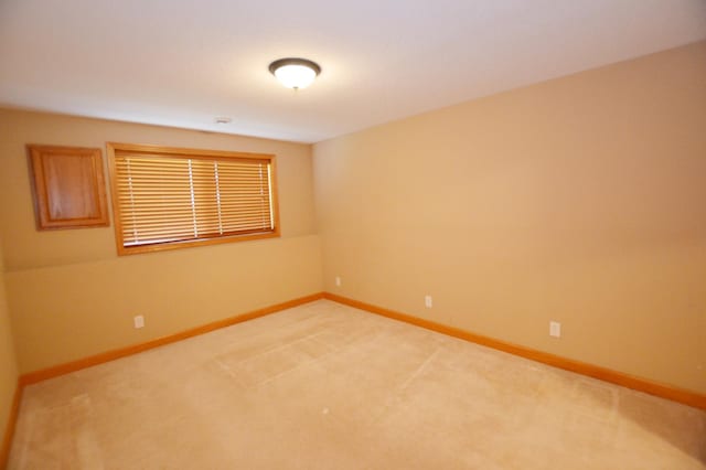 11096 16th St NE, Saint Michael, MN 55376 - spare room featuring light carpet and baseboards