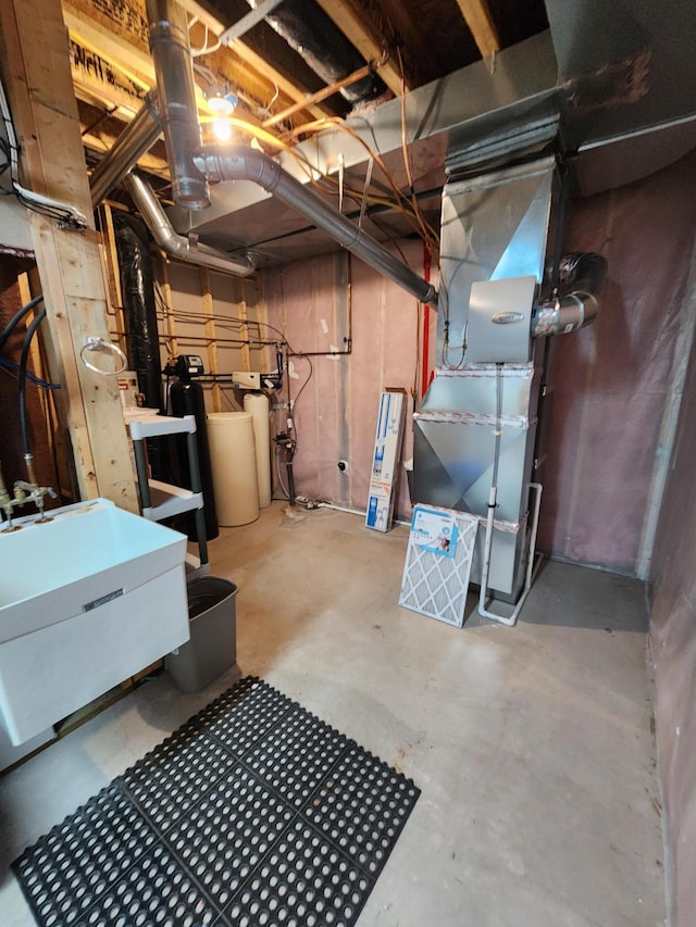 11096 16th St NE, Saint Michael, MN 55376 - unfinished basement with a sink, a water softener, and heating unit