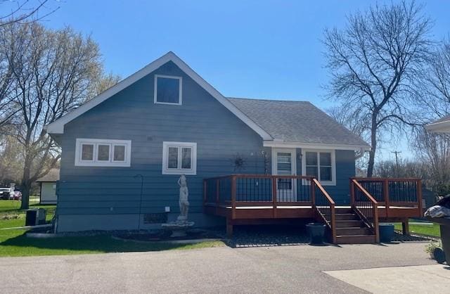 back of property featuring a deck