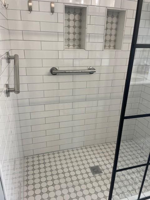 full bathroom with tiled shower