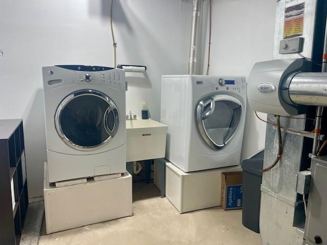 washroom featuring washer and dryer
